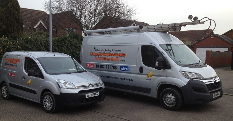 warm air replacements and heating services vans